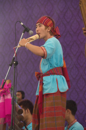 An unidentified males playing bamboo mount organ is folk instruments perform a tourist show. At the Thai fair in the 232nd year of Rattanakosin city under Royal Benevolence.のeditorial素材