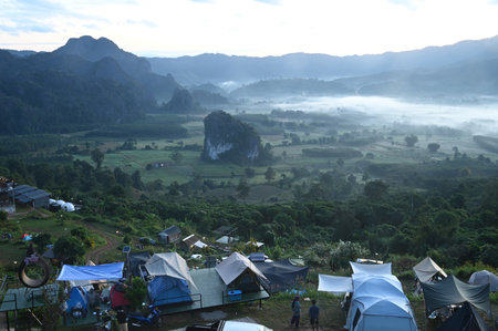 PHAYAO , THAILAND - DECEMBER 3 , 2023 :  Tent camping area for tourists at Phu Langka Forest Park,...