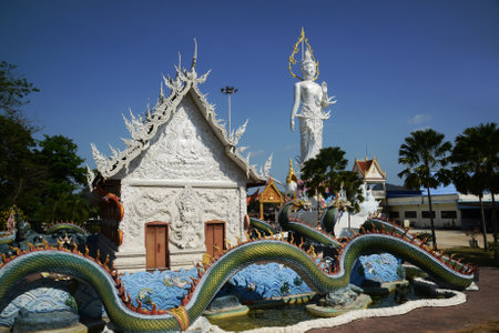 Wat Nong Jab Tao is a temple with a beautiful white ordination hall. It stands out with its beautiful stucco art of Naga sculptures in the surrounding area.の写真素材