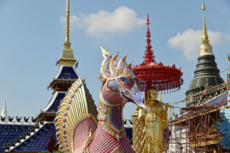The statues of bird in Thai literature and monks are Thai art that decorate the front of the pagoda...