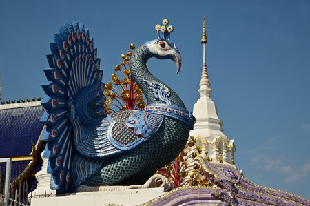 The statues of peacock in Thai literature are Thai art that decorate the front of the pagoda at Wat Den Sali Si Mueang Kaen temple. Located at Chiang Mai Province in Thailand.の写真素材