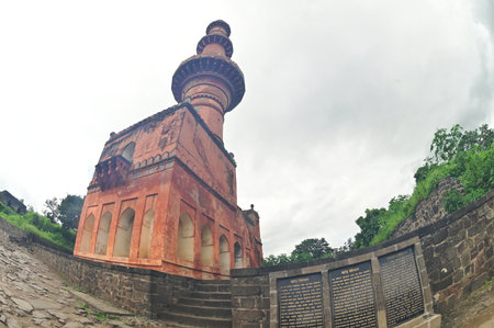 Chand Minar (Tower of the Moon) in Daulatabad fort entrance in maharashtra india.  Built with massive stone walls showcasing medieval military architecture and cultural heritageIt.の写真素材