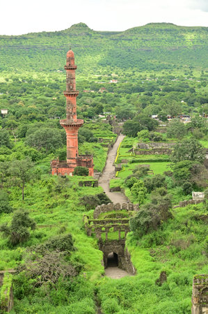 Chand Minar (Tower of the Moon) in Daulatabad fort entrance in maharashtra india.  Built with massive stone walls showcasing medieval military architecture and cultural heritageIt.の写真素材