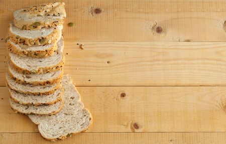 Whole wheat bread on wooden background.copy space