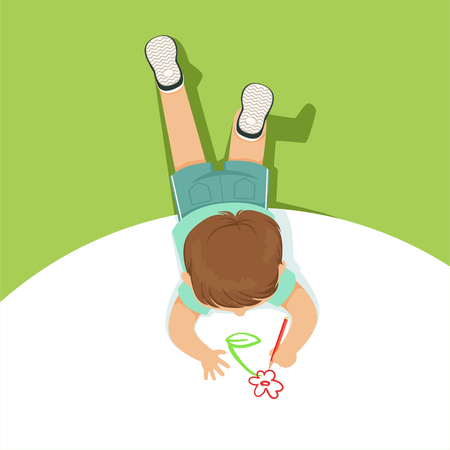 Little boy lying on his stomach and drawing flower using pencil, top view of child on the floor vector Illustrationのイラスト素材