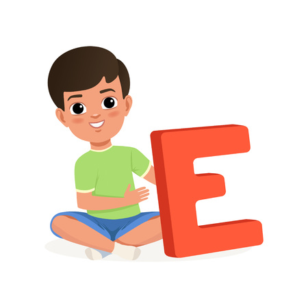 Cute black-haired boy sitting with crossed legs and holding big red letter E. Cartoon character of little kid in t-shirt and shorts. Fun educational game. Child development center. Flat vector design.のイラスト素材