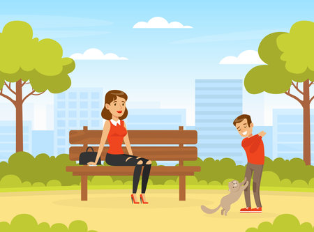 Mom and Her Son Walking with Cat in Urban Park, Boy Playing with Pet Animal Outdoors while his Mother Sitting on Bench Cartoon Vector Illustrationのイラスト素材