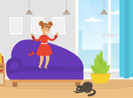 Cute Girl Playing with her Cat with Bow, Kid Having Fun with Pet Animal at Home Cartoon Vector Illustrationのイラスト素材