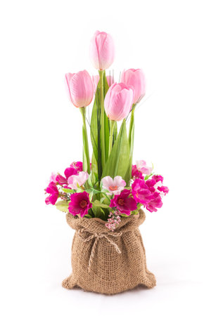the isolated image of the fake flower with red tulips on white backgroundの写真素材