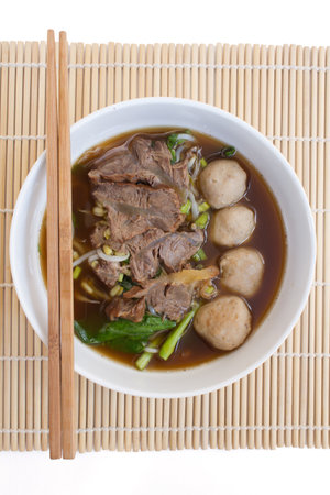 Chinese clear soup with boiled entrails and vegetables and meat balls