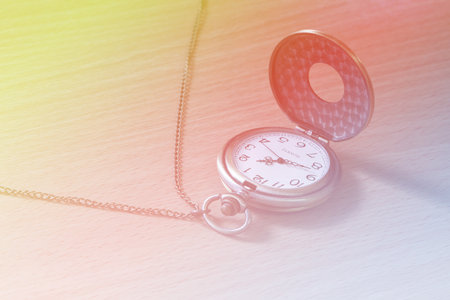 beautiful bright old watch with color filter soft focus background