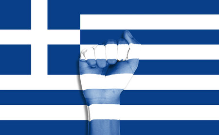 hand on the greece flag background.の写真素材