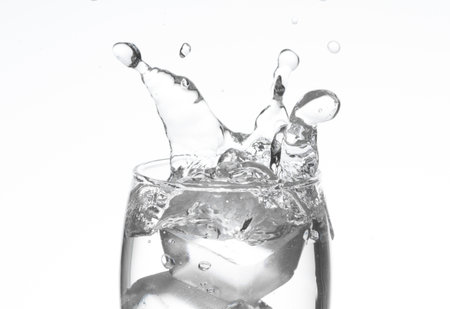 Pour into a glass on white backgrondの写真素材