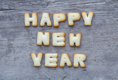 Happy New Year 2016 greeting with cookies letters on wood backgroundの写真素材