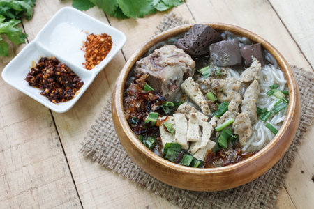 Pork Spare Ribs Rice Noodles Soup,Vietnamese Noodle Soup on wood background