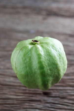 Guava isolated on wood background,Kim cuの写真素材