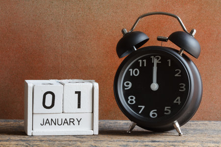 Still life concept, Happy new year by wood calendar and alarm clockの写真素材