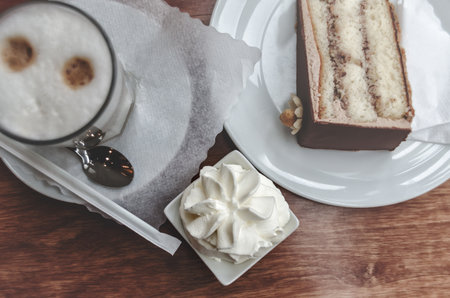 Top view of morning breakfast, pastry, meringue and latte