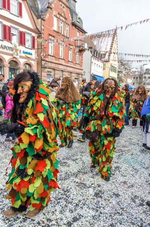 Germany, Lahr - JANUARY 17: Participants in costumes perform a street procession Carneval Fasnacht January 17, 2016 in the city of Lahr, Germany. Traditionally, the festive and cultural carnival procession through the streets of cities and towns in Germanのeditorial素材