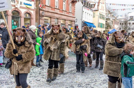 Germany, Lahr - JANUARY 17: Participants in costumes perform a street procession Carneval Fasnacht January 17, 2016 in the city of Lahr, Germany. Traditionally, the festive and cultural carnival procession through the streets of cities and towns in Germanのeditorial素材