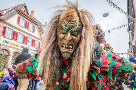 Germany, Lahr - JANUARY 17: Participants in costumes perform a street procession Carneval Fasnacht January 17, 2016 in the city of Lahr, Germany. They perform Gugge Music and dress up as witches.のeditorial素材