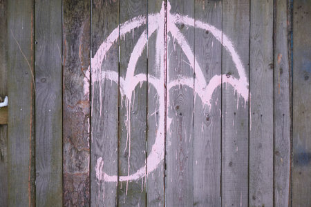 Old wooden fence background texture. The umbrella painted on the fenceの写真素材