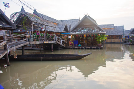 rowboat was under the wood bridge at the See Pak floating market, Cholburi, Thailandの写真素材