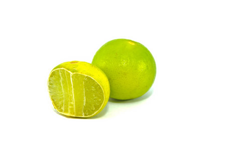 fresh lemon with half isolated on white backgroundの写真素材