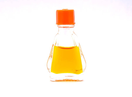 small perfume glass bottle isolated on white backgroundの写真素材