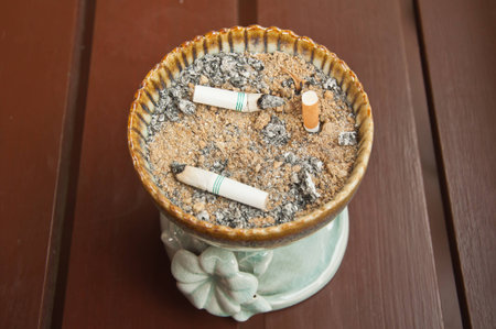ashtray with cigarettes and sandの写真素材