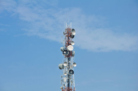 telecommunication tower on clear blue skyの写真素材