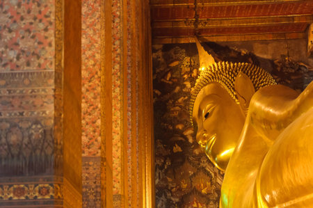 Face of reclining buddha statue at Wat Pho temple public place, Bangkok, Thailandの写真素材