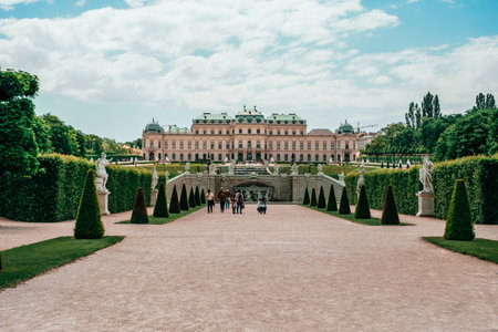 Vienna, Austria - May 8, 2018: Antique sculpture and Belvedere garden with clipped bushes in Vienna, Austria in a beautiful spring dayのeditorial素材