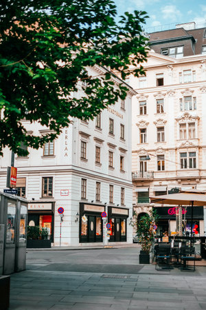 Vienna, Austria - May 8, 2018: Cityscape view on the beautiful streets of Vienna with cafes, tourists and hotels.のeditorial素材