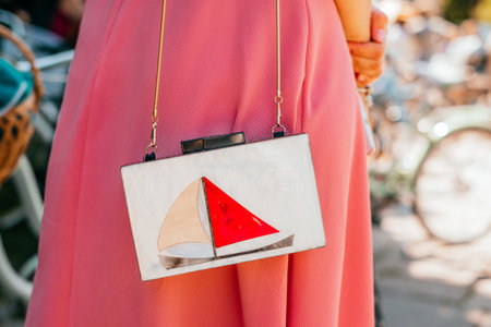 Kiev, Ukraine - May 12, 2018: Detail of outfit and clutch bag participating in bicycle tweed run Retro cruise on May 12, 2018 in Kiev, Ukraine.のeditorial素材