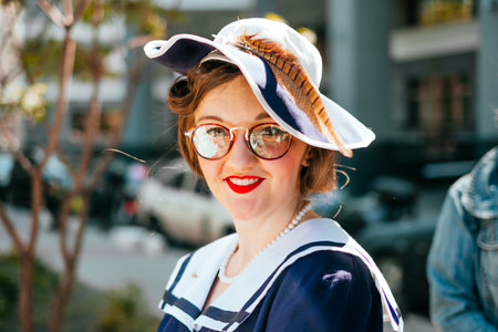 Kiev, Ukraine - May 12, 2018: Girl in blue vintage dress participating in bicycle tweed run Retro...