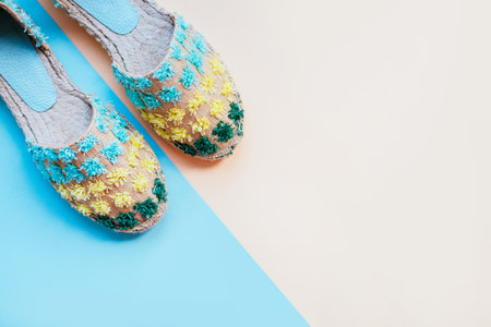 Summer fashion flatlay with gradient espadrille sandals on the two-toned blue and beige background. Perfect beach set for holidays on the sea. Marina style.の写真素材