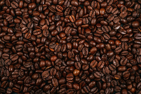 Roasted brown coffee beans background. Flatlay style, messy pattern.の写真素材