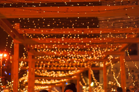 Blurred background of Christmas garland lights. Warm and sparkle.の写真素材