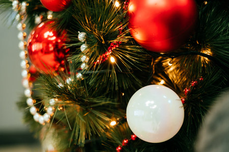 Background with Christmas tree decoration and gold garland.の写真素材