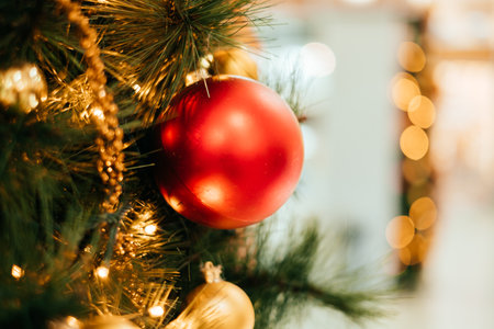 Background with Christmas tree decoration and gold garland.の写真素材