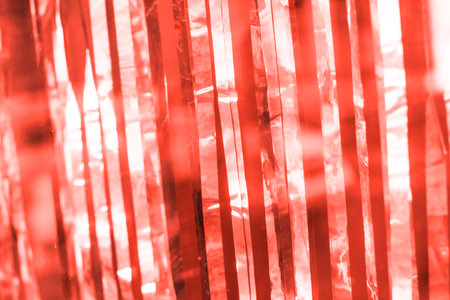 Silver holographic Christmas tinsel decoration. Thin strips of sparkling material.の写真素材