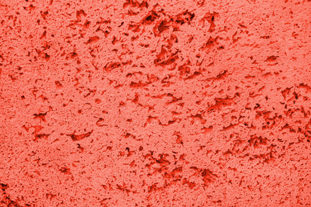 Living Coral color of the year 2019 stone texture background.