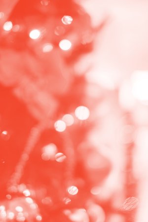 Bright abstract living coral background with blurred lights.の写真素材