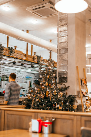 Kyiv, Ukraine - December 23, 2018: Christmas tree with gifts and decoration in the restaurant.のeditorial素材