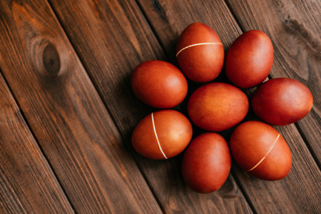 Red natural colored Easter eggs flatlay on the wooden background.の写真素材