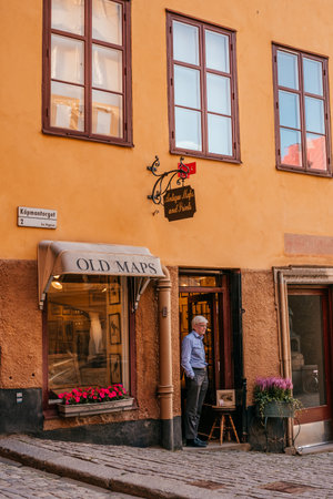 Stockholm, Sweden - June 27, 2019: Old narrow streets and yellow buildings of Stockholm.のeditorial素材