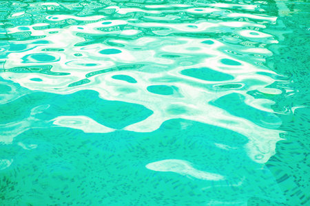Bright azure surface swimming pool water backgroundの写真素材