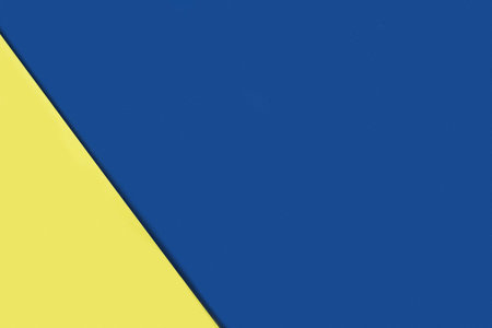 Bright abstrackt geometric background of lemon yellow and classic blue colors.の写真素材