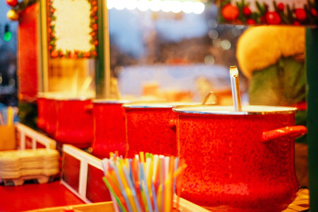 Hot mulled wine in a metal cauldrons at Christmas market.の写真素材